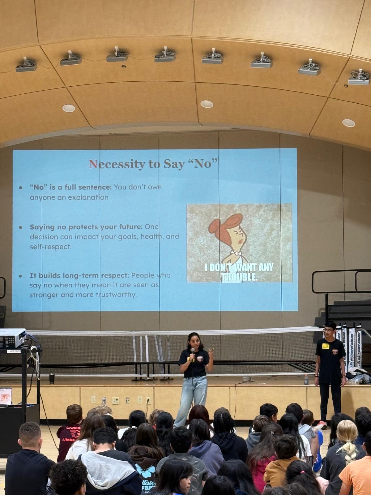 Prisha speaking to students during an I CAN workshop